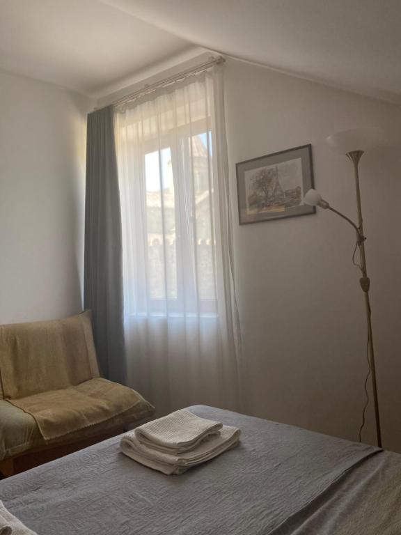 Postel nebo postele na pokoji v ubytování Hotel Cité