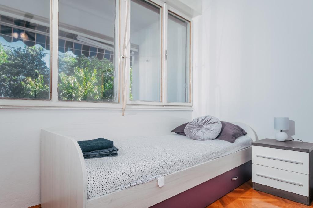 Posteľ alebo postele v izbe v ubytovaní Apartman LARA