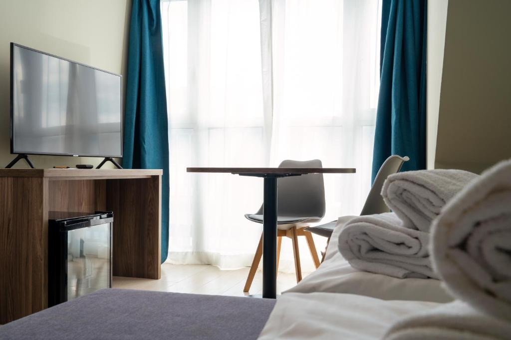 TV a/nebo společenská místnost v ubytování Hotel Astor