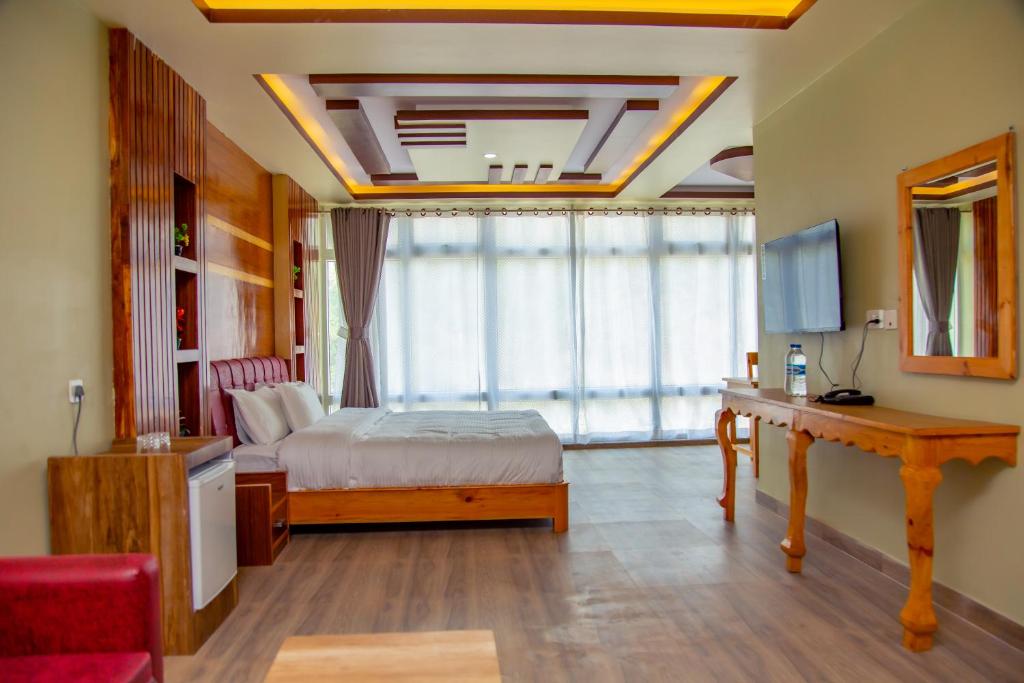 Postel nebo postele na pokoji v ubytování Hotel Gyan Gauri Palace