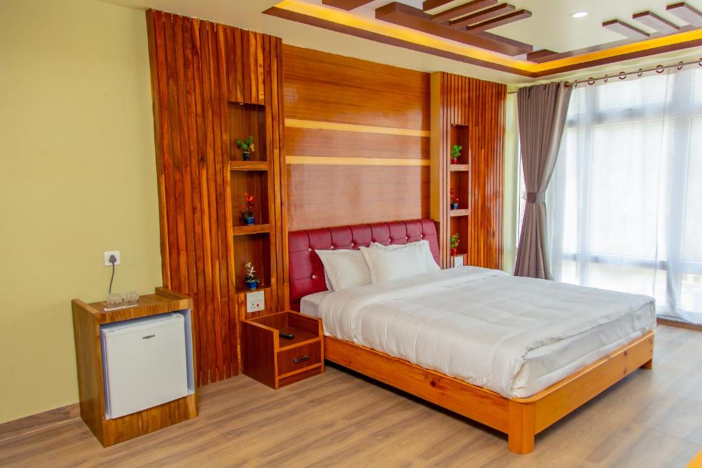 Postel nebo postele na pokoji v ubytování Hotel Gyan Gauri Palace