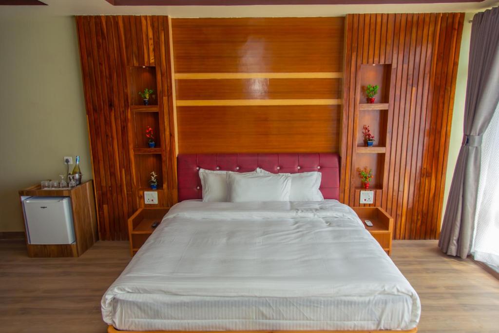 Postel nebo postele na pokoji v ubytování Hotel Gyan Gauri Palace