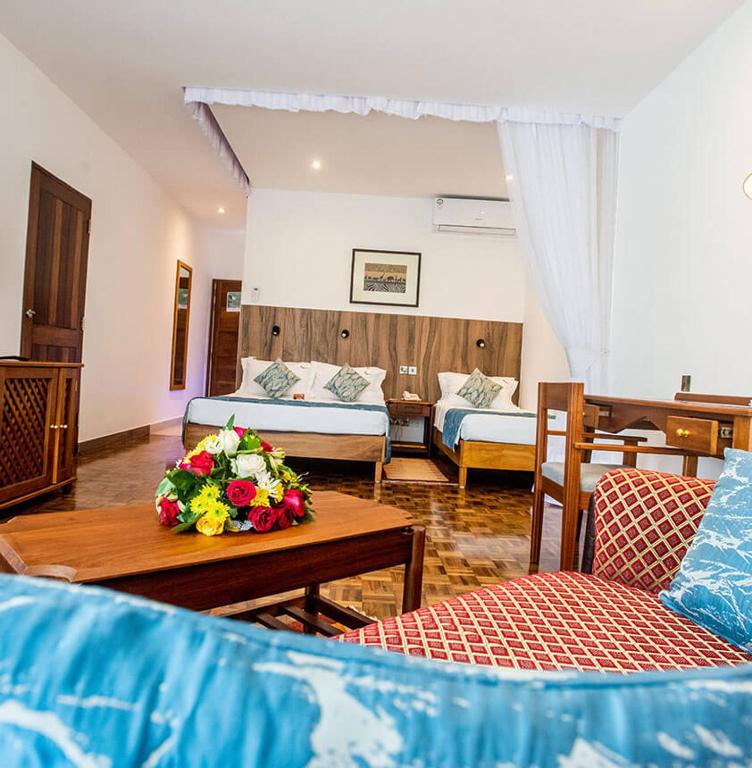 Postel nebo postele na pokoji v ubytování Travellers Beach Hotel & SPA