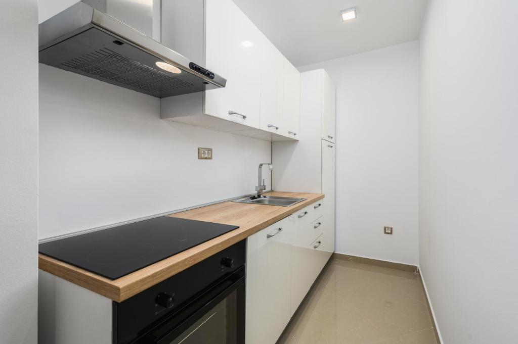 Kuchyň nebo kuchyňský kout v ubytování Rotonda Inn Novigrad