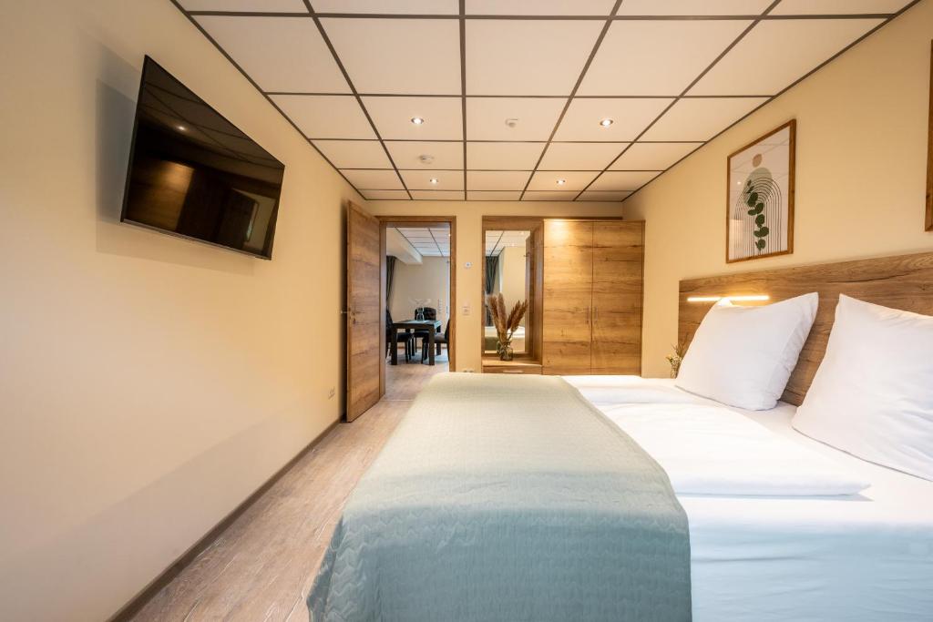 Postel nebo postele na pokoji v ubytování Apart Hotel Lang