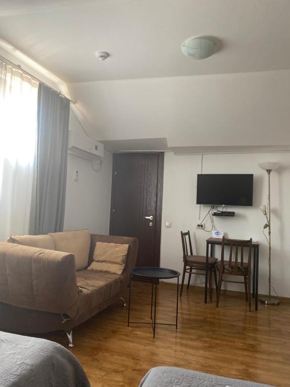 TV a/nebo společenská místnost v ubytování Hotel Cité