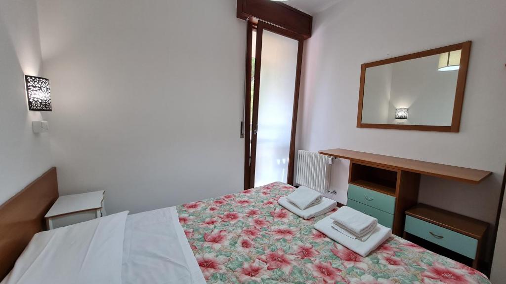 Łóżko lub łóżka w pokoju w obiekcie Panorama Apartment Peschiera