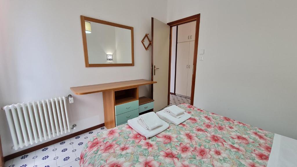 Łóżko lub łóżka w pokoju w obiekcie Panorama Apartment Peschiera
