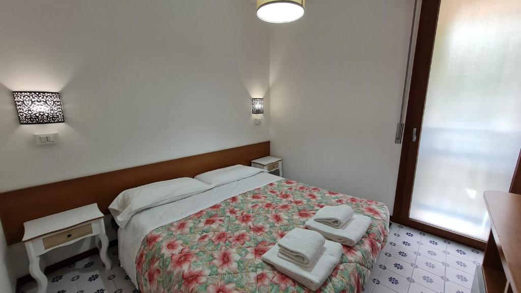 Łóżko lub łóżka w pokoju w obiekcie Panorama Apartment Peschiera
