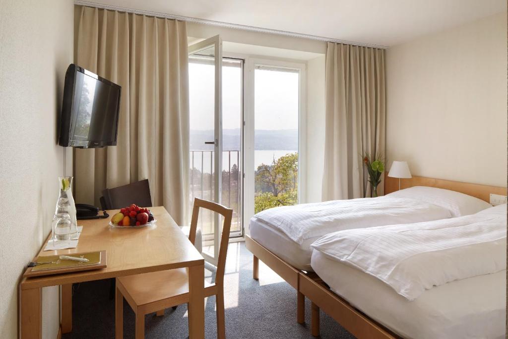 Postel nebo postele na pokoji v ubytování Hotel Boldern