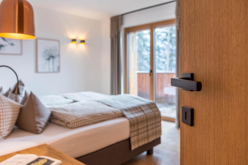 Postel nebo postele na pokoji v ubytování Schartneralm Birke