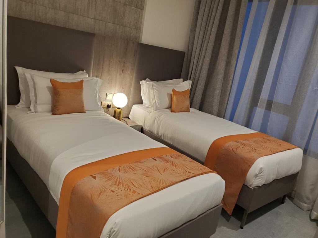 Postel nebo postele na pokoji v ubytování Baraka Tower Hotel