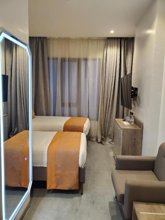 Postel nebo postele na pokoji v ubytování Baraka Tower Hotel