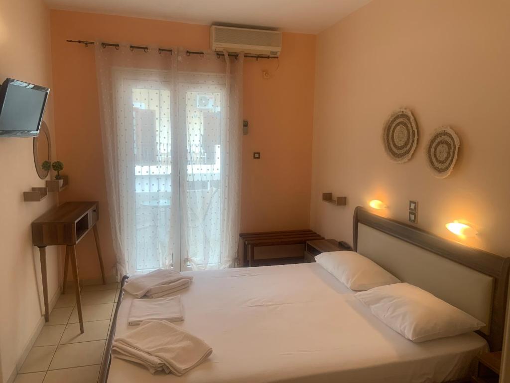 Postel nebo postele na pokoji v ubytování Isidora Hotel