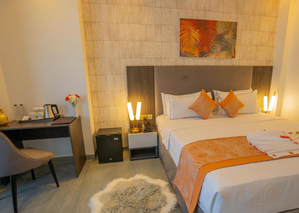 Postel nebo postele na pokoji v ubytování Baraka Tower Hotel