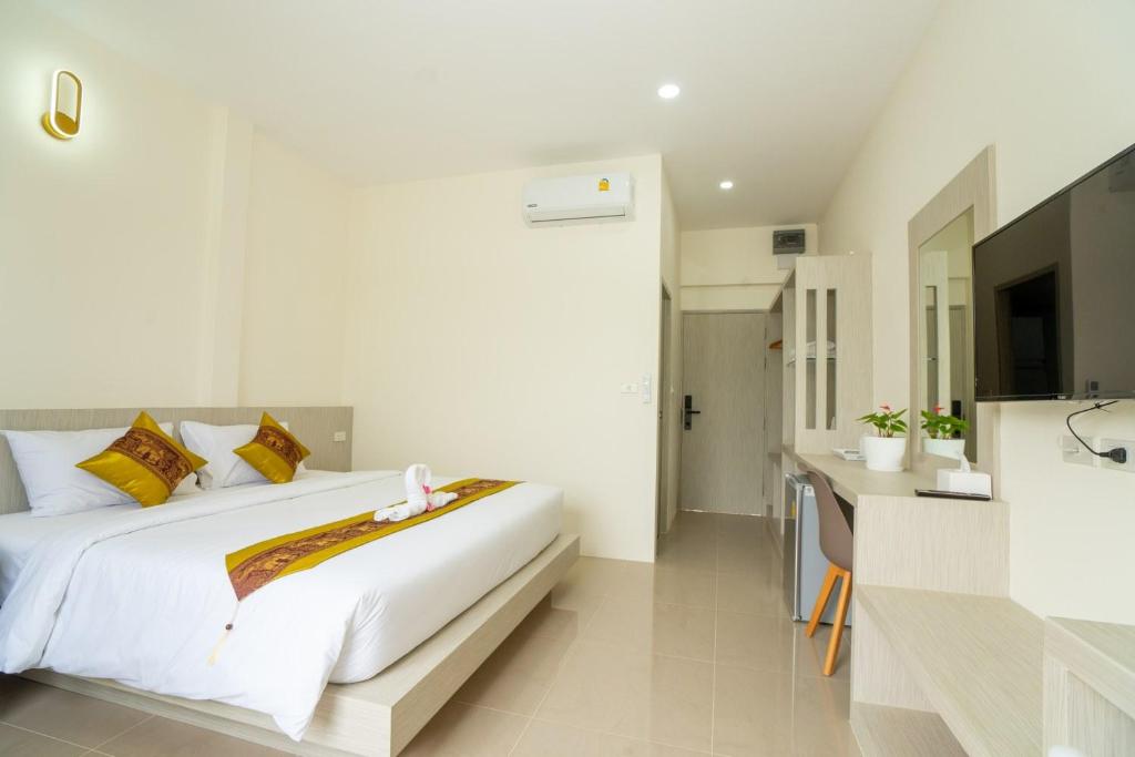 Postel nebo postele na pokoji v ubytování Puean Chang Resort Phuket