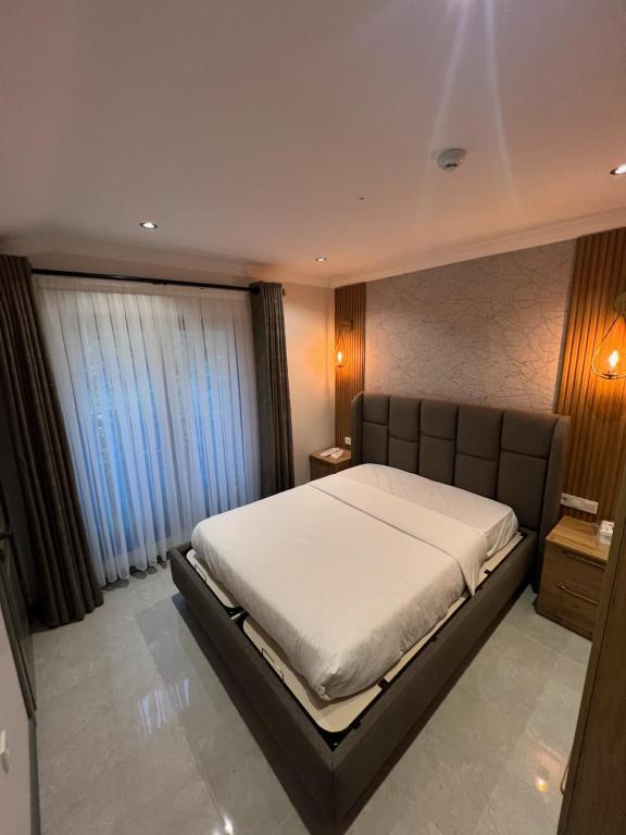 A bed or beds in a room at İmera Suite Otel