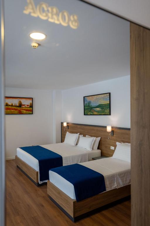 Postel nebo postele na pokoji v ubytování Acros Resort