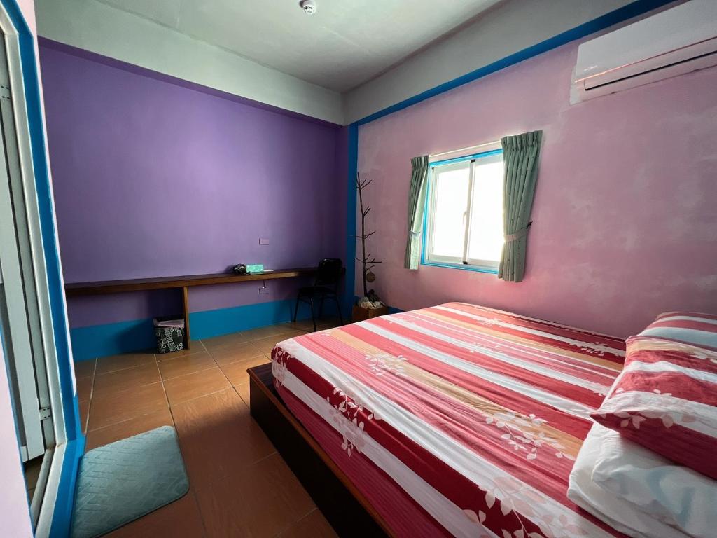 Llit o llits en una habitació de Orchid Island Faai B&B