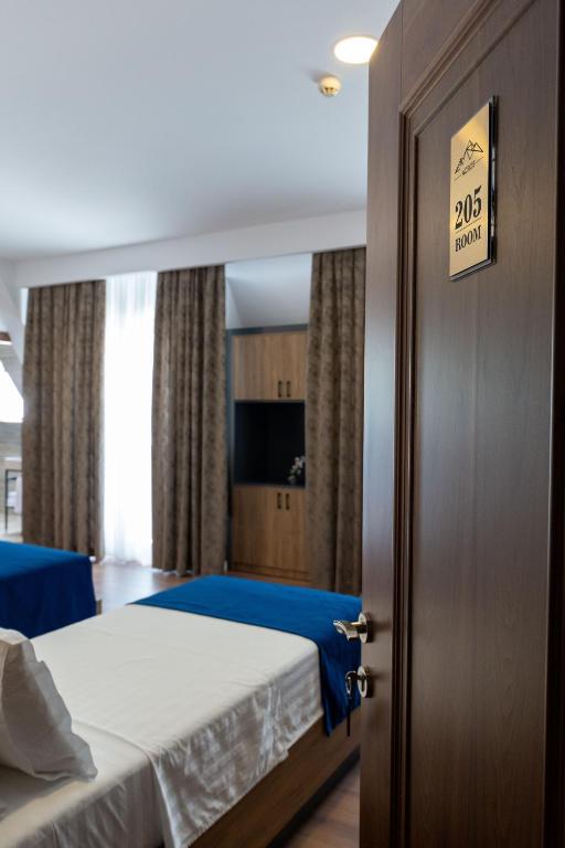 Postel nebo postele na pokoji v ubytování Acros Resort