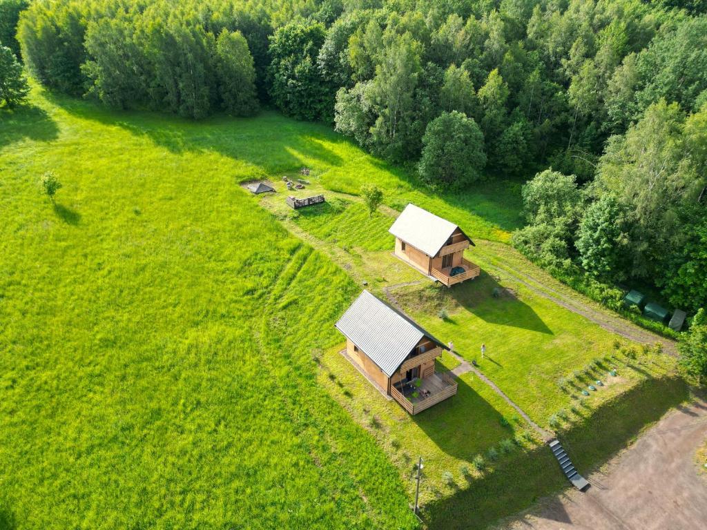 an aerial view of a cabin in a field with trees at Domki w Bartnicy - Góry Sowie in Sokolec