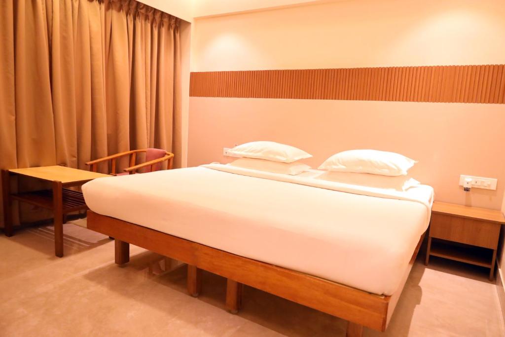 Postel nebo postele na pokoji v ubytování Hotel Surguru
