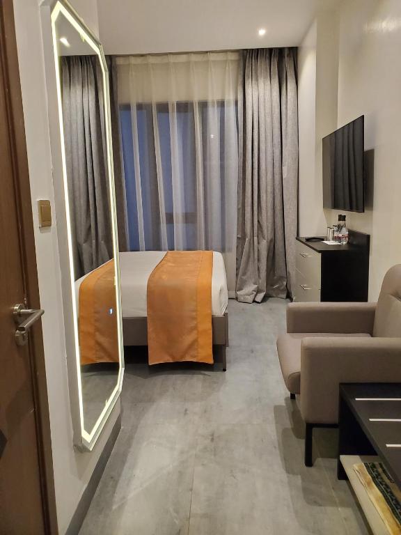 TV a/nebo společenská místnost v ubytování Baraka Tower Hotel