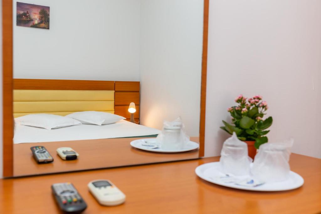 Postel nebo postele na pokoji v ubytování Hotel Sir Colentina