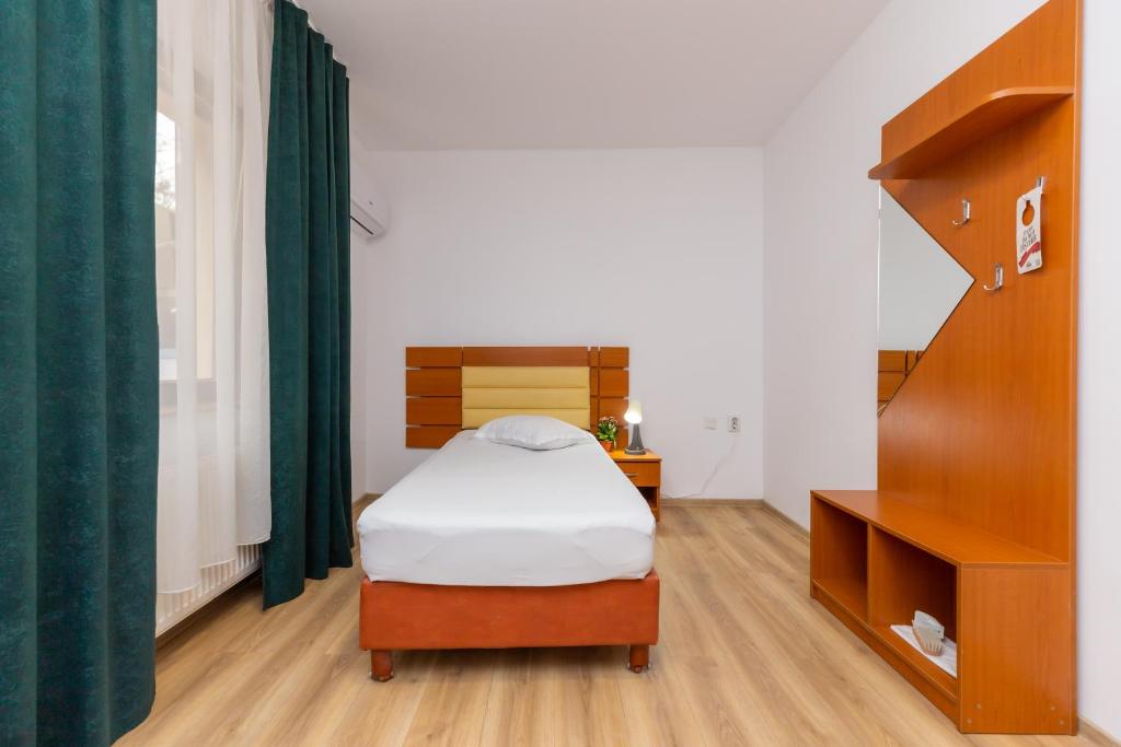 Postel nebo postele na pokoji v ubytování Hotel Sir Colentina