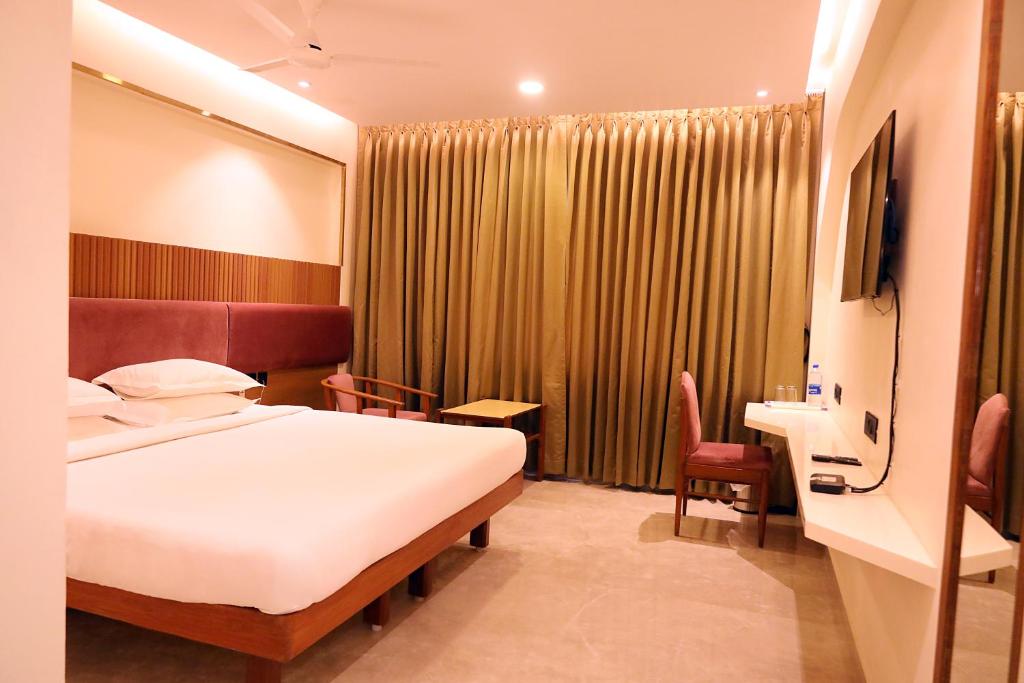 Postel nebo postele na pokoji v ubytování Hotel Surguru