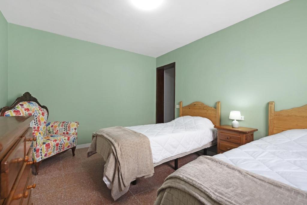 A bed or beds in a room at Casa Carmencita