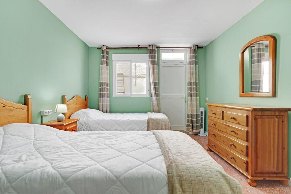 A bed or beds in a room at Casa Carmencita