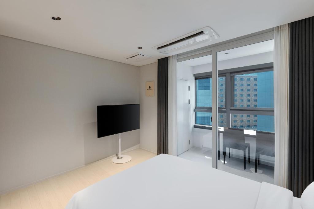 TV a/nebo společenská místnost v ubytování NewCZ Haeundae Residence