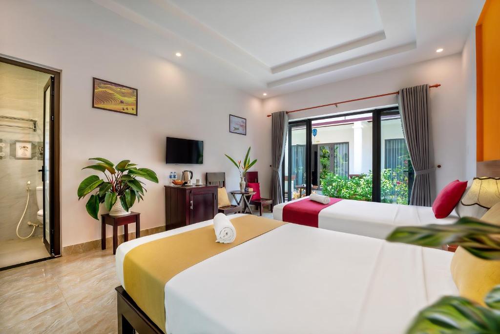 Postel nebo postele na pokoji v ubytování Laughter garden