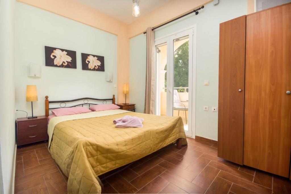 Postel nebo postele na pokoji v ubytování Scorpios Apartments