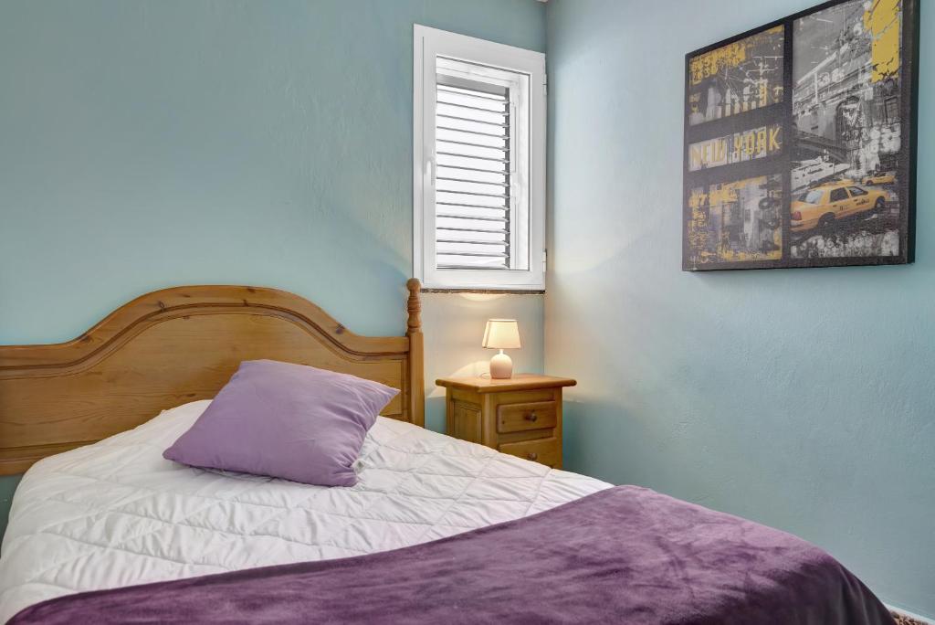 A bed or beds in a room at Casa Carmencita