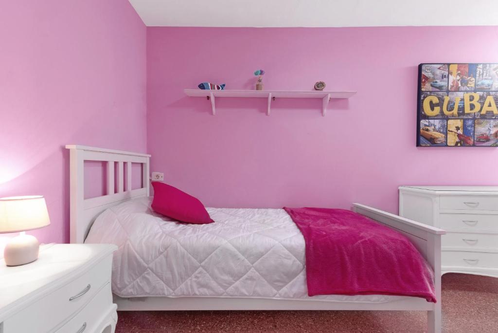 A bed or beds in a room at Casa Carmencita