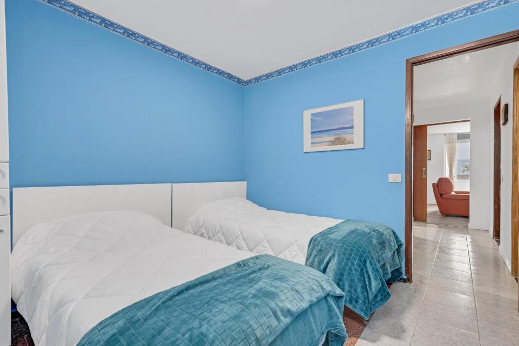 A bed or beds in a room at Casa Carmencita