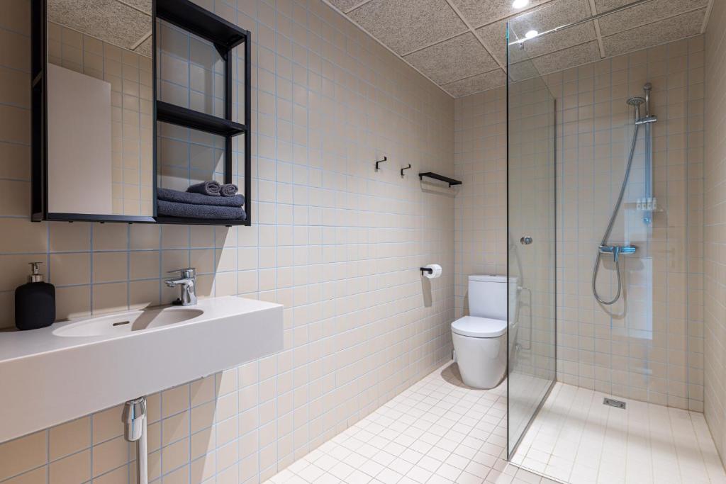Koupelna v ubytování Hugo Apartment Hotel