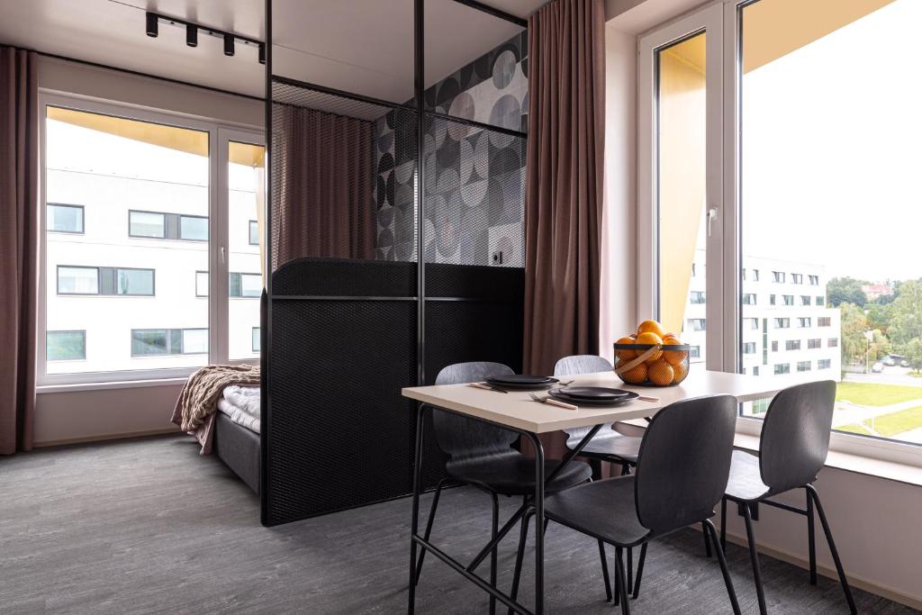 Postel nebo postele na pokoji v ubytování Hugo Apartment Hotel