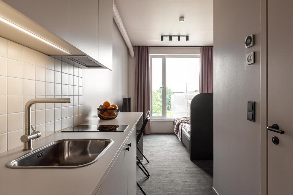 Kuchyň nebo kuchyňský kout v ubytování Hugo Apartment Hotel