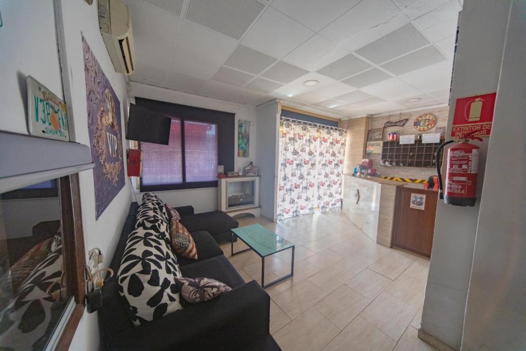 TV a/nebo společenská místnost v ubytování Hostal Virginia