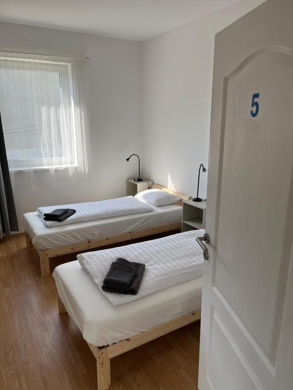 Postel nebo postele na pokoji v ubytování Alba Vendégház