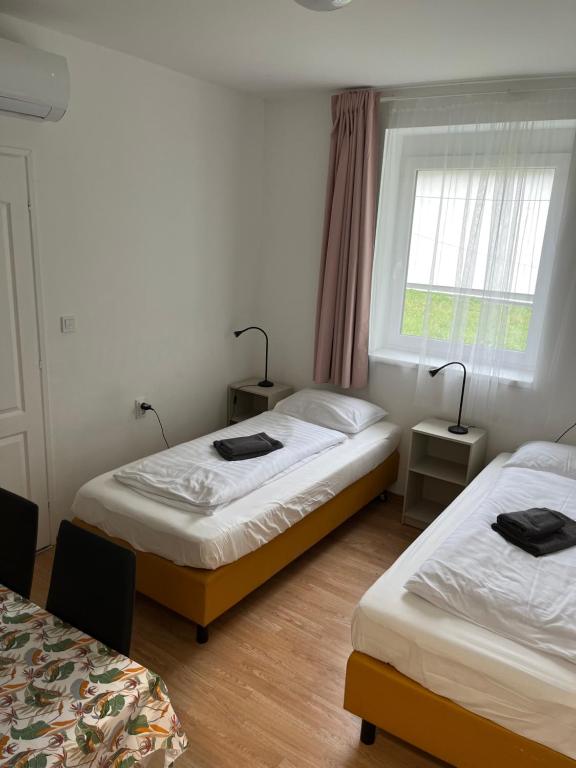 Postel nebo postele na pokoji v ubytování Alba Vendégház