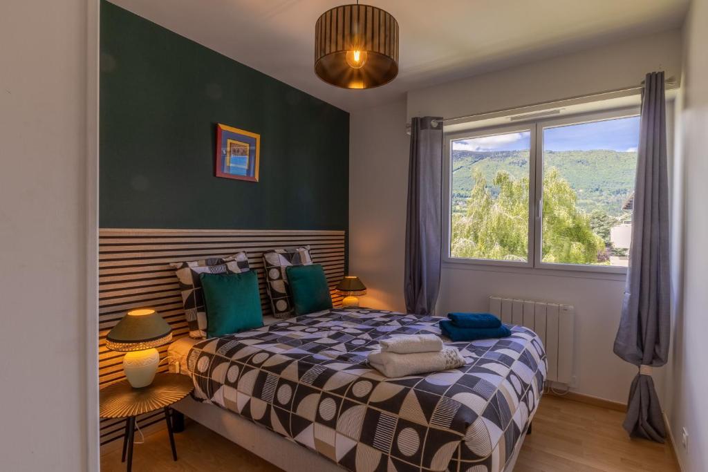 En eller flere senge i et værelse på Eden Lac et Montagnes