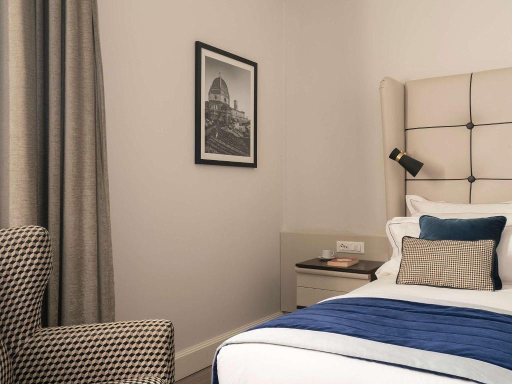 Postel nebo postele na pokoji v ubytování Cerretani Hotel Firenze - MGallery Collection
