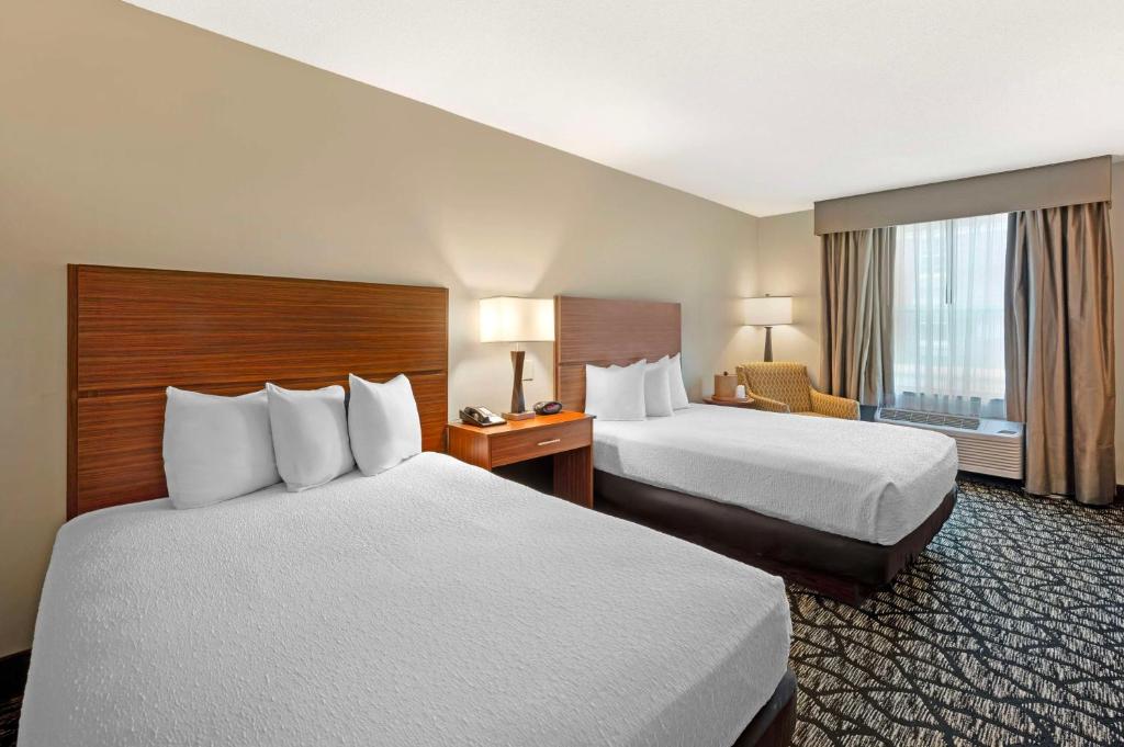 a hotel room with two beds and a window at Best Western Westminster Hotel in Westminster