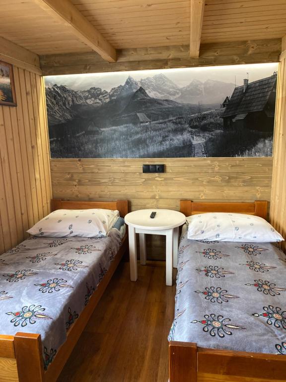 Posteľ alebo postele v izbe v ubytovaní Chatka u Staszka