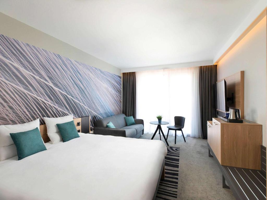 Postel nebo postele na pokoji v ubytování Novotel Szeged