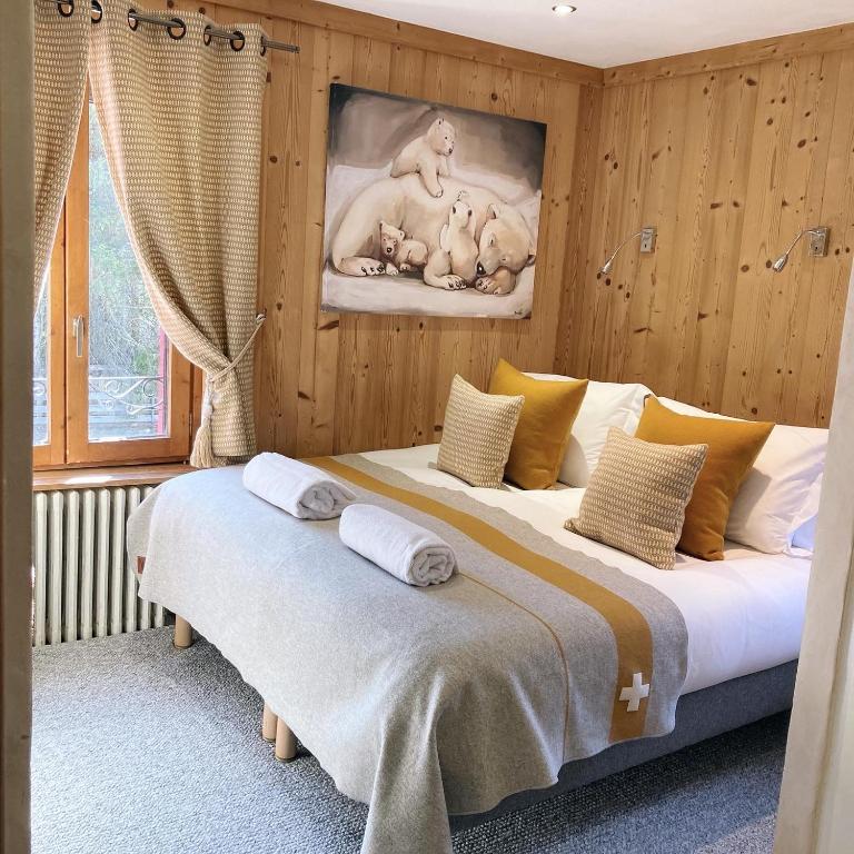 Postel nebo postele na pokoji v ubytování Hôtel Les Cimes